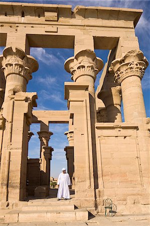 simsearch:841-06033889,k - Man in white jellabiya in front of the Kiosk of Trajan at the Philae Temples, UNESCO World Heritage Site, Nubia, Egypt, North Africa, Africa Stock Photo - Rights-Managed, Code: 841-06033860