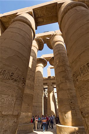 Tourists dwarfed by the towering columns of the Great Hypostyle Hall of the Karnak Temple of Amun, Thebes, UNESCO World Heritage Site, Egypt, North Africa, Africa Stock Photo - Rights-Managed, Code: 841-06033895