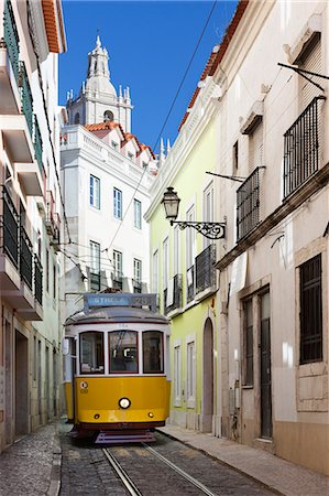 public transit not subway not bus - Tram (electricos) along Rua das Escolas Gerais with tower of Sao Vicente de Fora, Lisbon, Portugal, Europe Stock Photo - Rights-Managed, Code: 841-06345285
