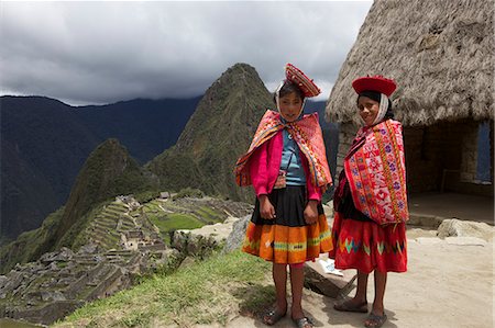 Traditionally dressed children looking over the ruins of Machu Picchu, UNESCO World Heritage Site, Vilcabamba Mountains, Peru, South America Stock Photo - Rights-Managed, Code: 841-06345390