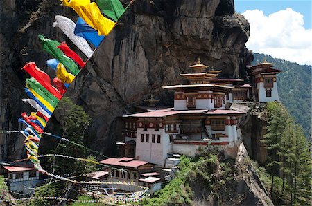 Taktshang Goemba (Tigers nest monastery) with prayer flags and cliff, Paro Valley, Bhutan, Asia Stock Photo - Rights-Managed, Code: 841-06341758