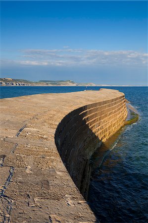 seawall - The stone Cobb or harbour wall, a famous landmark of Lyme Regis, Jurassic Coast, UNESCO World Heritage Site, Dorset, England, United Kingdom, Europe Stock Photo - Rights-Managed, Code: 841-06342068