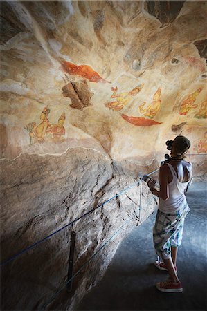 Tourist taking photos of ancient frescoes, Sigiriya, UNESCO World Heritage Site, North Central Province, Sri Lanka, Asia Stock Photo - Rights-Managed, Code: 841-06343739