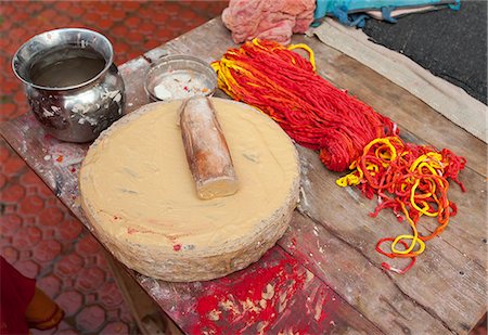 Sandalwood paste for tilaks, and kumkum, the sacred combination of holy thread and coloured powder, Sonepur, Bihar, India, Asia Stock Photo - Rights-Managed, Code: 841-06343889