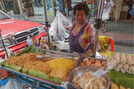 A street vendor prepares a plate of Pad Thai on Khaosan Road, Banglamphu, Bangkok, Thailand, Southeast Asia, Asia Stock Photo - Rights-Managed, Code: 841-06444548