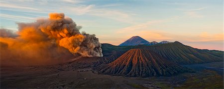 Mount Bromo (Gunung Bromo), an active volcano, erupting at sunrise throwing up ash clouds, East Java, Indonesia, Southeast Asia, Asia Stock Photo - Rights-Managed, Code: 841-06444952