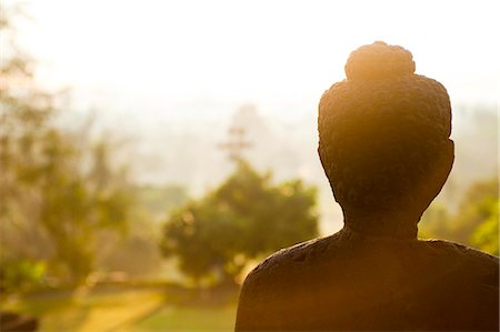 Stone Buddha statue at sunrise at the Buddhist Temple, Borobudur (Borobodur), UNESCO World Heritage Site, Java, Indonesia, Southeast Asia, Asia Stock Photo - Rights-Managed, Code: 841-06445033