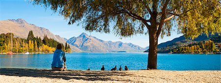 relaxed autumn - Panorama of a tourist relaxing by Lake Wakatipu in autumn at Queenstown, Otago, South Island, New Zealand, Pacific Stock Photo - Rights-Managed, Code: 841-06445181
