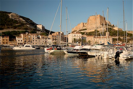 A view of yachts in the harbour and the citadel in Bonifacio, Corsica, France, Mediterranean, Europe Stock Photo - Rights-Managed, Code: 841-06445566