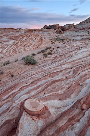 sandstone - Red and white sandstone layers with colorful clouds at sunset, Valley Of Fire State Park, Nevada, United States of America, North America Stock Photo - Rights-Managed, Code: 841-06446812