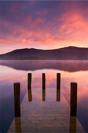 Fiery autumn sunrise over Derwent Water from Hawes End jetty, Lake District National Park, Cumbria, England, United Kingdom, Europe Stock Photo - Rights-Managed, Code: 841-06447444