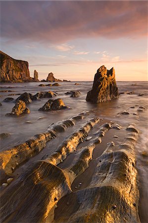 simsearch:841-07082971,k - Golden evening sunlight bathes the rocks and ledges at Bantham in the South Hams, Devon, England, United Kingdom, Europe Stock Photo - Rights-Managed, Code: 841-06447477