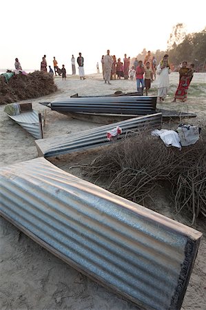 rivers of india - Small boats made from single sheets of corrugated iron, lying on the sandy banks of the River Hugli (River Hooghly), West Bengal, India, Asia Stock Photo - Rights-Managed, Code: 841-06447707