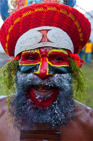 Colourfully dressed and face painted local tribesman celebrating the traditional Sing Sing in the Highlands, Papua New Guinea, Pacific Stock Photo - Rights-Managed, Code: 841-06448188