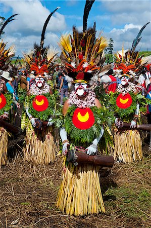 feather headdress tribe pictures - Colourfully dressed and face painted local tribes celebrating the traditional Sing Sing in the Highlands, Papua New Guinea, Pacific Stock Photo - Rights-Managed, Code: 841-06448214
