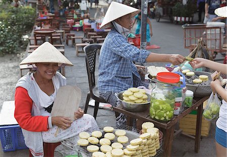 snack shop - Women sell hot potato snacks in the Ancient Town, Hoi An, Vietnam, Indochina, Southeast Asia, Asia Stock Photo - Rights-Managed, Code: 841-06499230