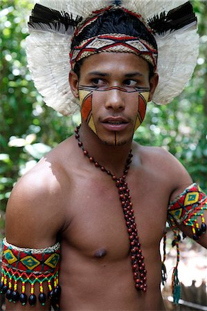 feather headdress tribe pictures - Portrait of a Pataxo Indian man at the Reserva Indigena da Jaqueira near Porto Seguro, Bahia, Brazil, South America Stock Photo - Rights-Managed, Code: 841-06500524