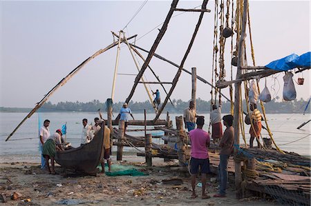 Fishermen preparing traditional boat and Chinese fishing net on the waterfront at Kochi (Cochin), Kerala, India, Asia Stock Photo - Rights-Managed, Code: 841-06500995