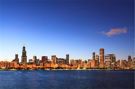 Chicago skyline and Lake Michigan at dusk with the Willis Tower, formerly the Sears Tower, on the left, Chicago, Illinois, United States of America, North America Stock Photo - Rights-Managed, Code: 841-06502058