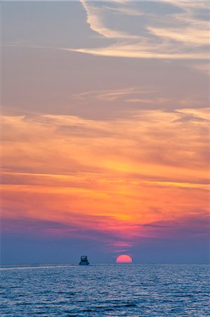 simsearch:841-06034119,k - Boat driving into the sunset at Zlatni Rat Beach, Bol, Brac Island, Dalmatian Coast, Adriatic, Croatia, Europe Stock Photo - Rights-Managed, Code: 841-06804695