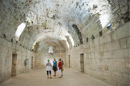 palaces interior - Tourists exploring the underground halls at Diocletian's Palace, UNESCO World Heritage Site, Split, Croatia, Europe Stock Photo - Rights-Managed, Code: 841-06804779