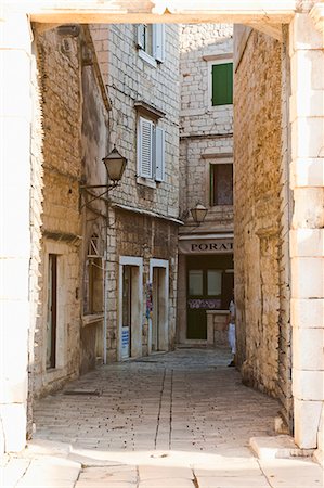 simsearch:841-06804846,k - Cobbled streets of Trogir seen through the South Town Gate, Trogir, UNESCO World Heritage Site, Dalmatia, Croatia, Europe Stock Photo - Rights-Managed, Code: 841-06804803