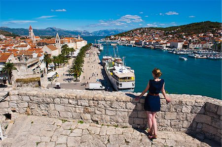 Tourist admiring the view from Kamerlengo Fortress over Trogir waterfront, Trogir, UNESCO World Heritage Site, Dalmatian Coast, Adriatic, Croatia, Europe Stock Photo - Rights-Managed, Code: 841-06804818