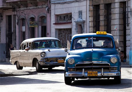 Vintage American car taxi on Avenue Colon during morning rush hour soon after sunrise, Havana Centro, Cuba, West Indies, Central America Stock Photo - Rights-Managed, Code: 841-06805779