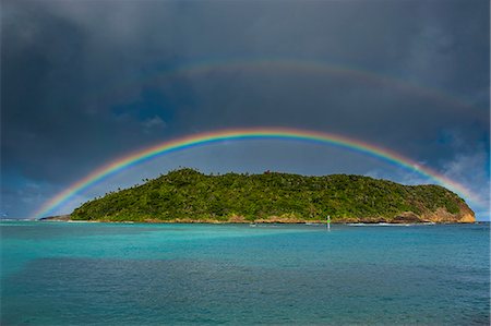 Incredible rainbow over an islet off Ofu Island, Manua Island group, American Samoa, South Pacific, Pacific Stock Photo - Rights-Managed, Code: 841-06807126