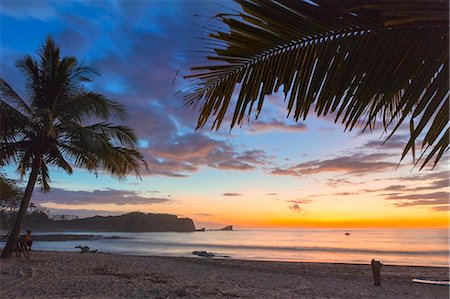 Sunset by the southern headland of beautiful Playa Pelada beach, Nosara, Nicoya Peninsula, Guanacaste Province, Costa Rica Stock Photo - Rights-Managed, Code: 841-06807456