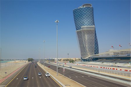 road with city - Hyatt Capital Gate Hotel near Abu Dhabi Exhibition Centre from Aloft Hotel, Abu Dhabi, United Arab Emirates, Middle East Stock Photo - Rights-Managed, Code: 841-07084004