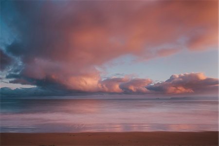 Dawn sky over Carbis Bay beach looking to Godrevy point, St. Ives, Cornwall, England, UK, Europe. Long exposure Stock Photo - Rights-Managed, Code: 841-07084493