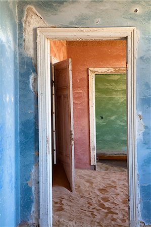 Interior of building slowly being consumed by the sands of the Namib Desert in the abandoned former German diamond mining town of Kolmanskop, Forbidden Diamond Area near Luderitz, Namibia, Africa Stock Photo - Rights-Managed, Code: 841-07081756