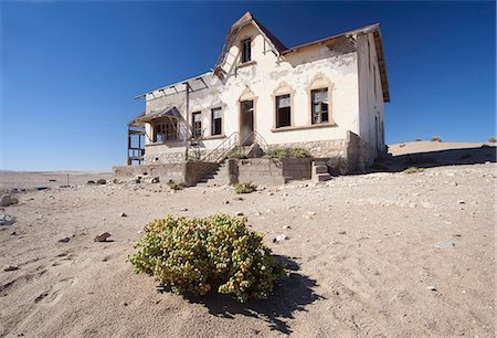 House slowly being reclaimed by the desert in the abandoned former German diamond mining town of Kolmanskop on the edge of the Namib Desert, Forbidden Diamond Area near Luderitz, Namibia, Africa Stock Photo - Rights-Managed, Code: 841-07081765