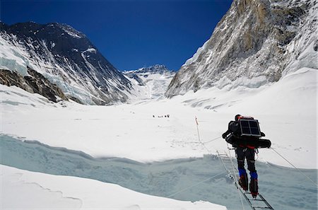 Climbers crossing crevasse and ladder on Mount Everest, Solu Khumbu Everest Region, Sagarmatha National Park, UNESCO World Heritage Site, Nepal, Himalayas, Asia Stock Photo - Rights-Managed, Code: 841-07082200