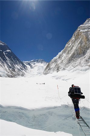Climbers crossing crevasse and ladder on Mount Everest, Solu Khumbu Everest Region, Sagarmatha National Park, UNESCO World Heritage Site, Nepal, Himalayas, Asia Stock Photo - Rights-Managed, Code: 841-07082201