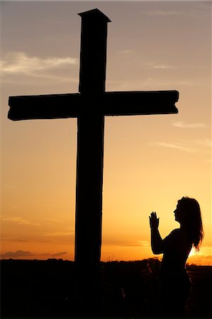 silhouette (darkened or blurred object or figure) - Woman praying at sunset, Cher, France, Europe Stock Photo - Rights-Managed, Code: 841-07083331