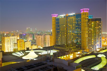 Grand Millennium Hotel and Al Wahda Mall at dusk, Abu Dhabi, United Arab Emirates, Middle East Stock Photo - Rights-Managed, Code: 841-07083912