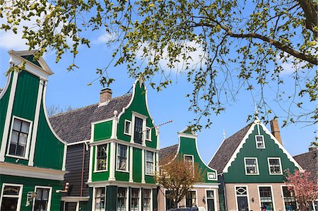 Preserved historic houses in Zaanse Schans, a village on the banks of the River Zaan, near Amsterdam, a tourist attraction and working museum, Zaandam, North Holland, Netherlands, Europe Stock Photo - Rights-Managed, Code: 841-07205874