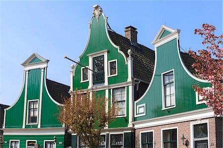 Preserved historic houses in Zaanse Schans, a village on the banks of the River Zaan, near Amsterdam, a tourist attraction and working museum, Zaandam, North Holland, Netherlands, Europe Stock Photo - Rights-Managed, Code: 841-07205873