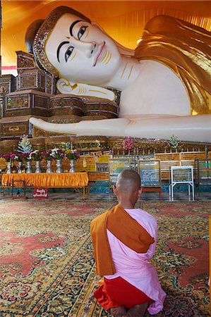Nun in front of reclining Buddha statue, Shwethalyaung, Bago (Pegu), Myanmar (Burma), Asia Stock Photo - Rights-Managed, Code: 841-07206202