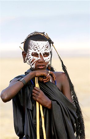 simsearch:841-03673550,k - Young recently circumcised Masai Warrior (moran) with traditional face paint after 'coming of age'  in the Serengei Plains, Tanzania Stock Photo - Rights-Managed, Code: 841-07201637