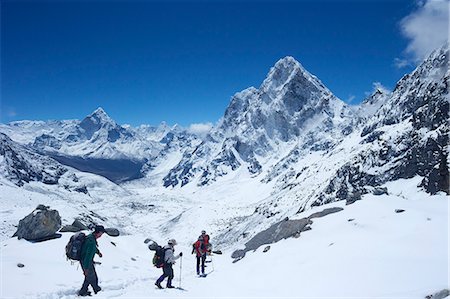 Trekkers walking over Cho La Pass with Ama Dablam on left and Arakam Tse on right, Solukhumbu District, Nepal, Himalayas, Asia Stock Photo - Rights-Managed, Code: 841-07202422