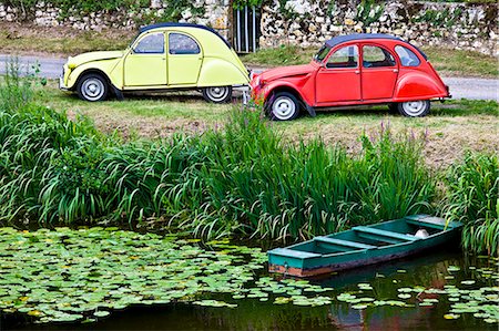 Traditional French Citroen Deux Chevaux 2CV cars at Angles Sur L'Anglin village, Vienne, near Poitiers, France Stock Photo - Rights-Managed, Code: 841-07354873