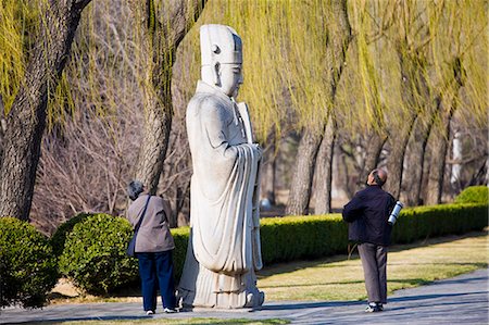 simsearch:841-07457235,k - Elderly tourists look at statue of a high civil official, advisor to the emperor, on Spirit Way, Ming Tombs, Beijing, China Stock Photo - Rights-Managed, Code: 841-07457230