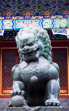 simsearch:841-07457235,k - Statue of a bronze male lion with paw on a ball at The Summer Palace, Beijing, China Stock Photo - Rights-Managed, Code: 841-07457232