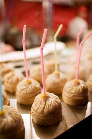 Chicken soup dumplings with straws for sale in the Night Market, Wangfujing Street, Beijing, China Stock Photo - Rights-Managed, Code: 841-07457242