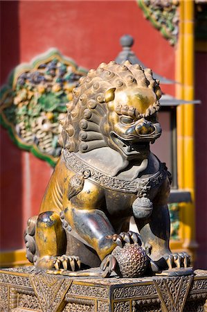 Gilded male lion statue with ball under paw in the Forbidden City, Beijing, China Stock Photo - Rights-Managed, Code: 841-07457263