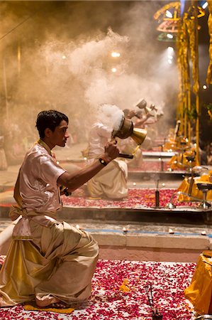 ethnic culture of india - Hindu priests at sundown Aarti Ritual Ceremony of Light during Shivrati Festival in Holy City of Varanasi, Benares, India Stock Photo - Rights-Managed, Code: 841-07589885