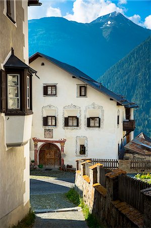 Old painted stone 17th century buildings in the village of Guarda, Engadine Valley, Graubunden, Switzerland, Europe Stock Photo - Rights-Managed, Code: 841-07589922